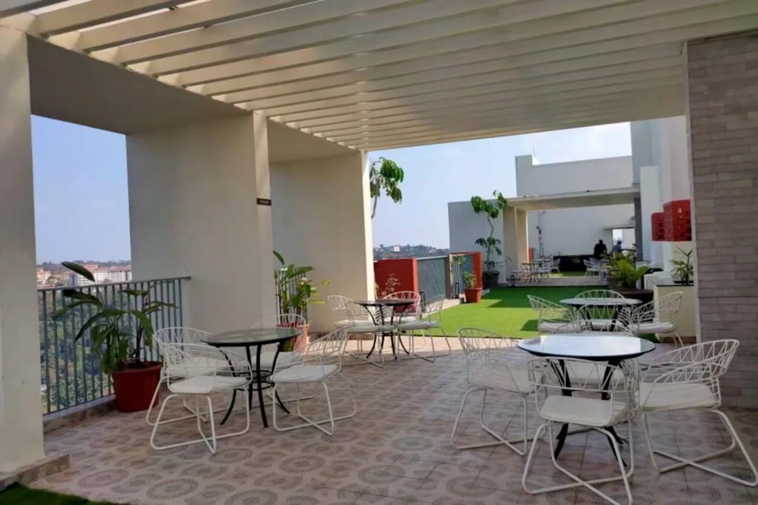 Tables and chairs on the shared Rio De Goa terrace