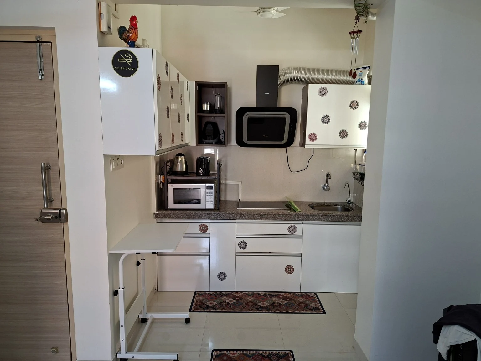 Apartment kitchen with storage, sink and countertop appliances