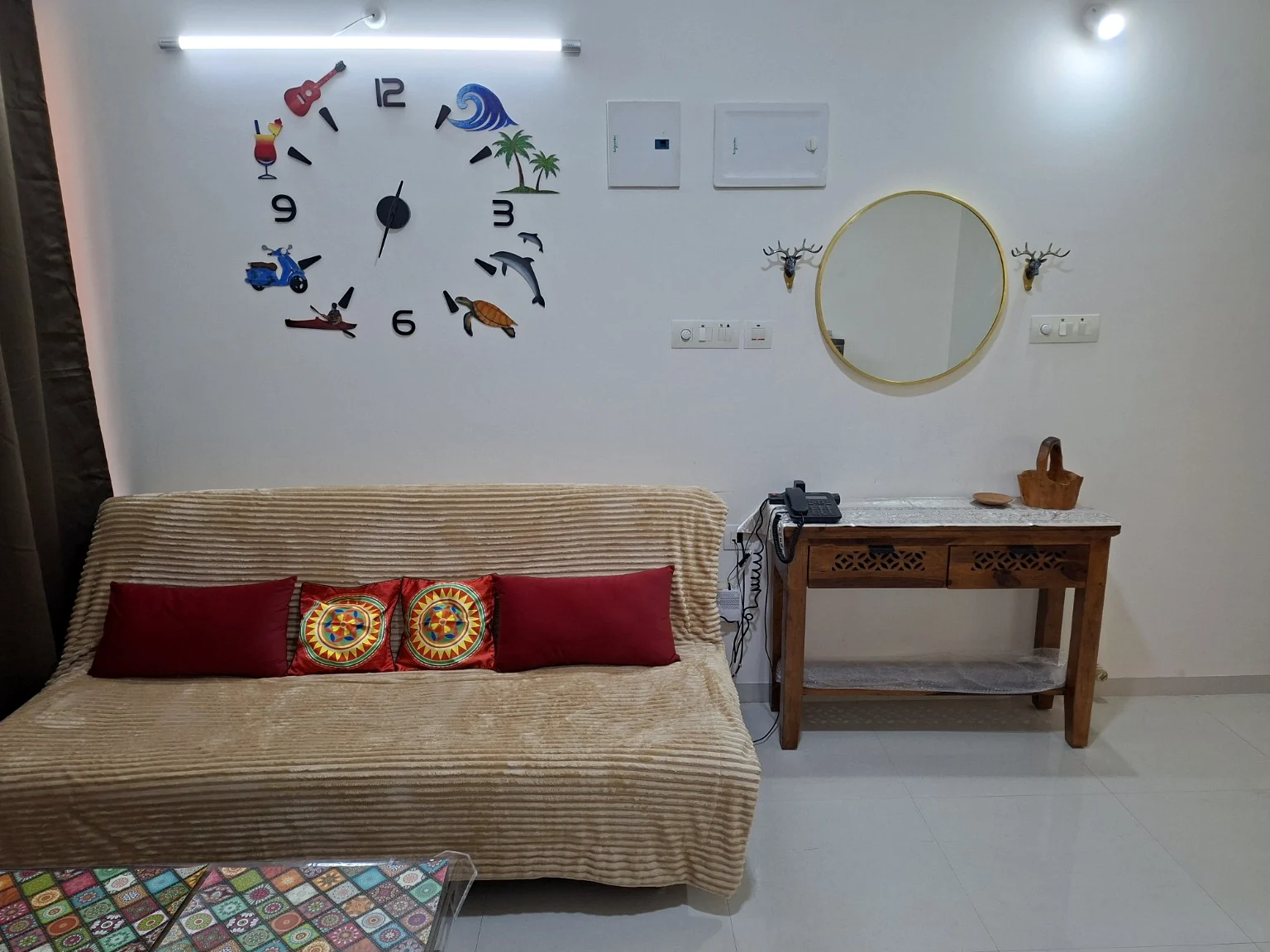 Sofa-cum-bed shown in its sofa arrangement beside a wooden table