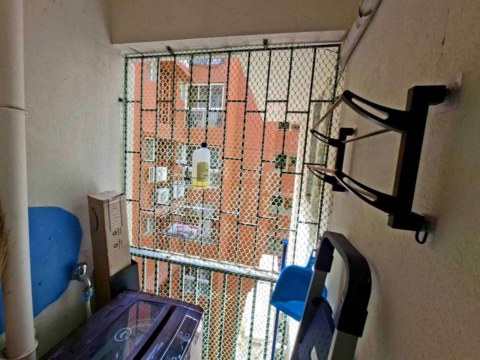 Practical utility balcony with washing machine and laundry space
